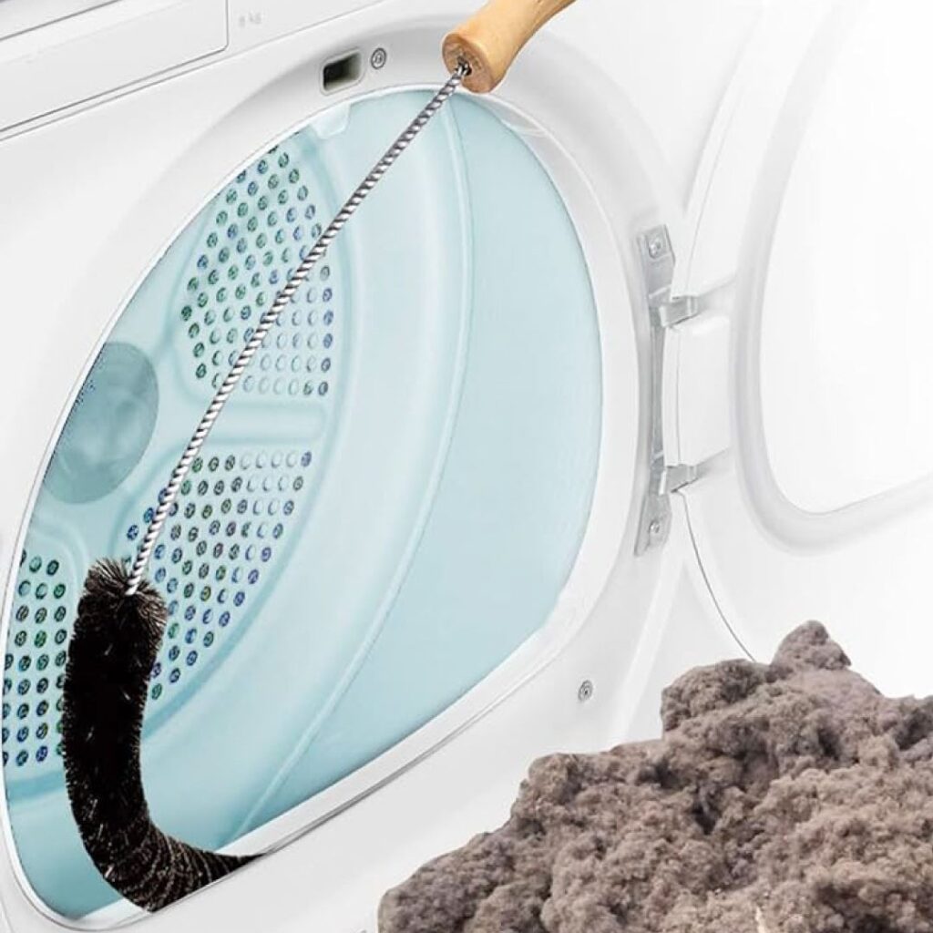 A technician uses a delinting brush to clean out the lint trap of a dryer.